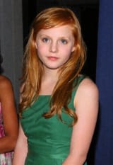 photo_of_a_redheaded_teenage_girl_with_long_wavy_red_hair__green_eyes__pale_white_skin_in_a_green_dress_at_prom_night-9