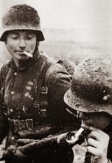 German soldier lighting his cigarette with a flamethrower, 1917