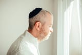 jewish-man-wearing-skull-cap-at-home