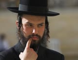 close-up-rabbi-wearing-hat_1048944-3060786