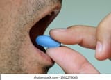hand-man-holding-blue-pill-260nw-1502273063