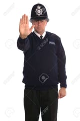 1850822-british-police-officer-gesturing-for-you-to-stop