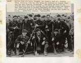 Sailors_of_a_landing_party_from_USS_Olympia_C6_return_from_fighting_Bolsheviks_along_the_Murmansk_railway_Bakharitza_Russia_September_6_1918_note_Mosin_1891_rifles