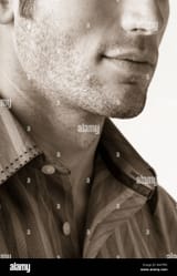 close-up-of-handsome-young-mans-chin-and-jawline-with-facial-hair-stubble-mens-grooming-and-personal-care-masculine-features-W47PFK
