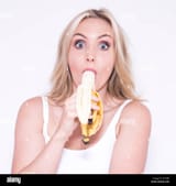 pretty-blonde-woman-eating-a-banana-KYTH98