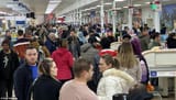 25965746-8113007-Shoppers_look_miserable_as_they_stand_in_line_at_Tesco_Extra_in_-a-106_1584236259177