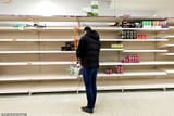 25965534-8111897-A_man_stands_in_front_of_empty_aisles_as_he_tries_to_stock_up_am-a-12_1584192505256