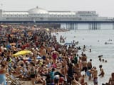 Crowds-fill-the-beach-near-Brighton-Pier