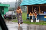 Nude-girl-buys-the-honey-in-the-rain-2