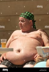 fat-man-with-huge-fat-belly-and-deep-belly-button-sweating-while-sitting-B6AC44[1]