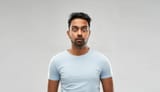 emotion-expression-people-concept-shocked-scared-man-t-shirt-over-grey-background-shocked-scared-man-over-grey-132925396