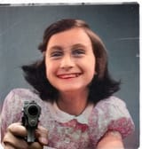 Anne pointing a gun at (You)