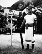Seaman_Second_Class_George_Peters_USN_of_the_Fita-Fita_Guard_stands_watch_outside_the_office_of_the_Provost_Marshal_of_American_Samoa_April_27_1943