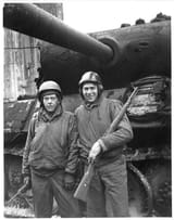 Asst-Gunner-John-Deriggi-with-a-captured_G24t_Mauser-&amp;-Asst-Driver-Homer-Davis-in-front-of-a-knocked-out-Panther-tank-in-Cologne-Germany-as-part-of-the-32nd-Medium-Tank-Battalion-Third-Armored-Division