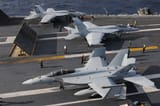 3252px-US_Navy_101209-N-9693M-009_Two_F-A-18E_Super_Hornets_prepare_for_a_catapult_assisted_launch_as_an_F-A-18E_Super_Hornet_taxis_toward_the_aft_of_USS