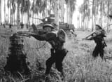 Australian_assault_on_pillbox,_January_1943,_Papua,_Giropa_Point