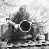 The_29cm_Petard_spigot_mortar_on_a_Churchill_AVRE_of_79th_Squadron-2C_5th_Assault_Regiment-2C_Royal_Engineers-2C_under_command_of_3rd_Infantry_Division-2C_29_April_1944._A_40lb_bomb_can_be_seen_on_the_85
