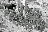 A-group-of-New-Zealand-soldiers-on-the-Cassino-battlefront-in-Italy-during-World-War-II.-Probably-reconstruction-for-photographers-behind-the-line.-5-April-1944