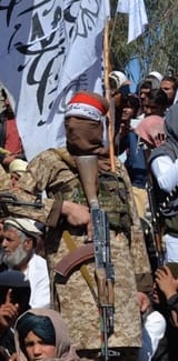 Taliban fighter flag