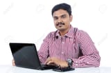 20535429-indian-business-man-with-laptop
