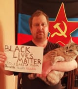 dpr blm commie faglord with very disappointed cat