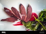 puffin-meat-dish-cooked-in-a-restaurant-in-reykjavik-capital-of-iceland-DNHM4D