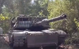Ukrainian_Soldiers_Enhance_US_M1A1_Abrams_Tanks_with_Advanced_Armor_and_Anti-Drone_Solutions_925_001-551115ed_webp