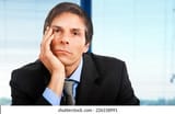 bored-businessman-portrait-260nw-226158991