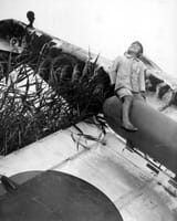 Japanese_Boy_atop_wreck_of_Kawasaki_Ki-61_Hien_Tony_in_Japan_1945
