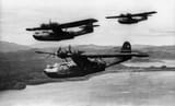 Three Consolidated PBY-5A Catalinas of patrol squadron VP-52 in the south-west Pacific in December 1943. VP-52 was based at Port Moresby, New Guinea at that time and was engaged in so-called Black Cat (nighttime) operations.