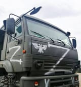 russian-military-truck-with-a-flag-of-the-imperium-of-man-v0-ncoyh8bph3k91