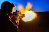 fireball-shooting-rifle-flames-shooting-out-end-ar-assault-rifle-shooting-range-103972276