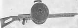1280px-Gast_machine_gun_with_drum_magazines