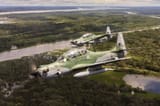 1920px-Aeronave_A-29_Super_Tucano_em_voo_sobre_a_Floresta_Amazônica