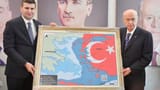 Recep Tayyip Erdogan poses with greek invasion map