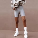 grey-sweatshirt-silver-bike-shorts-white-athletic-shoes-large-39629