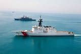 US Coast Guard next to a Frigate
