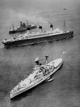 RMS Berengaria passes between two Revenge-class battleships at the 1935 Spithead Naval Review