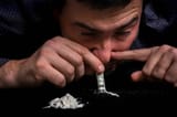depositphotos_184677376-stock-photo-junkie-man-snorting-cocaine-powder-2405559374