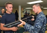 Flickr_-_Official_U.S._Navy_Imagery_-_A_Sailor_gives_shotgun_familiarization_training.