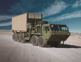 M1074A1_PLS_with_Oshkosh_CHU