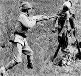 A Japanese officer summarily bayonets a wounded Chinese prisoner. Despite such atrocities, Japanese prisoners were treated generously by their Chinese captors during and after the war.