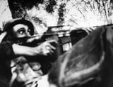 An embedded photographer snaps a reaction of U.S Soldier during a Vietcong Ambush 1966
