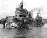 Damaged_USS_New_Orleans_(CA-32)_reaching_Tulagi_on_1_December_1942