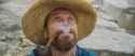 Willem Dafoe looks up with a pipe in his mouth_thumb.jpg