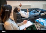 male-patient-pouring-out-his-emotions-during-the-therapy-session-2J6HY0M-425571000