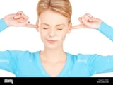 woman-with-fingers-in-ears-WK8J58