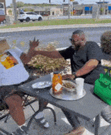 two people laughing on table