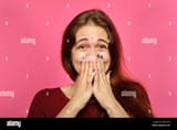 amazed-face-smiling-joyful-woman-cover-mouth-hands-2JM1E9X-183361474