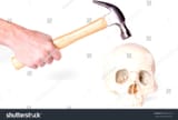stock-photo-hand-holding-hammer-ready-to-hit-a-skull-isolated-338581223